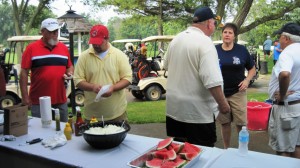 Golfers enjoy hot dogs at the turn